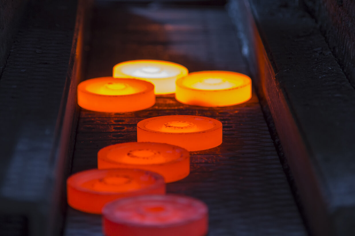 worker forging steel bar