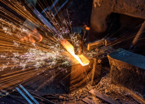 worker forging steel bar
